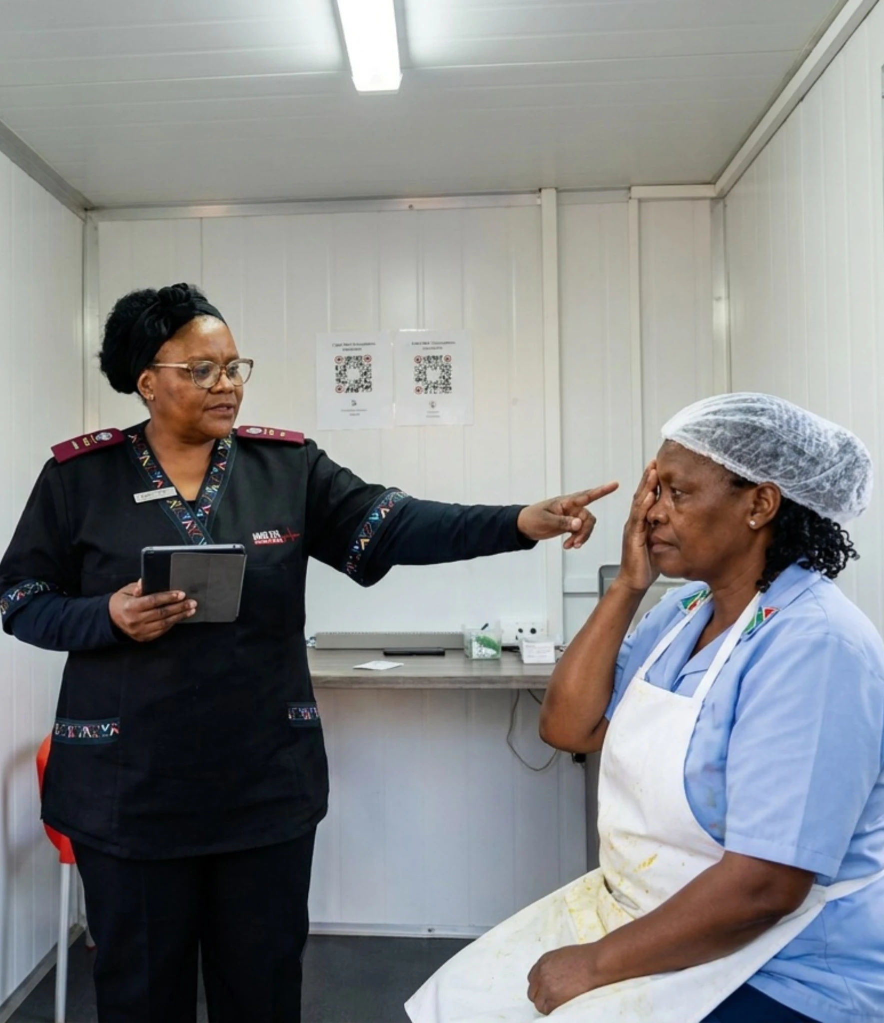 A Care Net practitioner completing a food handler medical on the production line